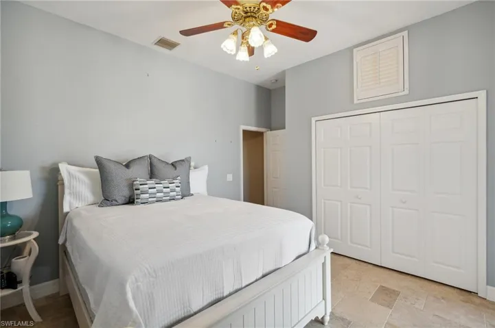 Bedroom with a closet and ceiling fan