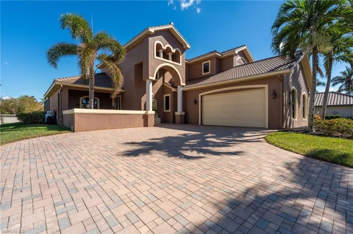 Mediterranean / spanish home featuring a garage