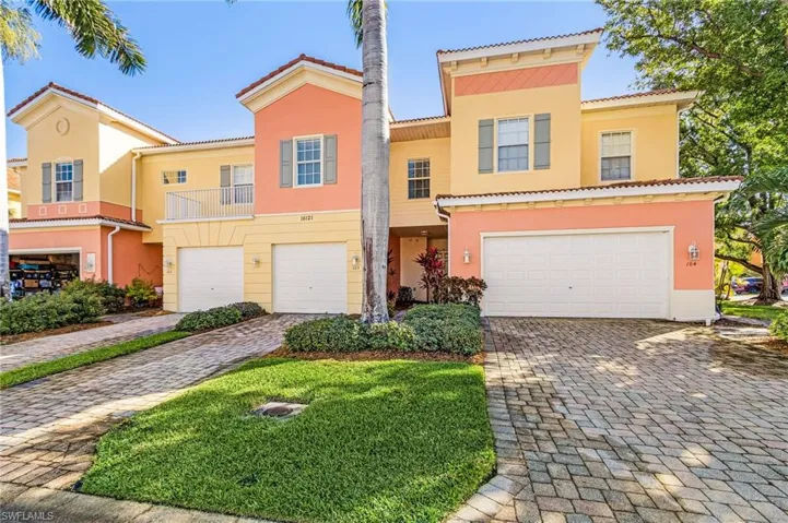 Mediterranean / spanish home with a garage, stucco siding, and a balcony