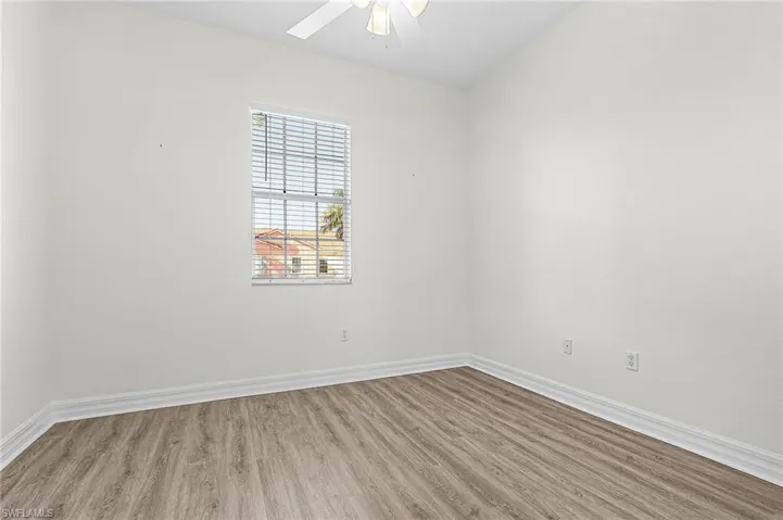 Unfurnished room with wood finished floors and ceiling fan