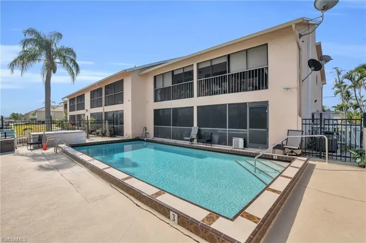 Community pool featuring a patio
