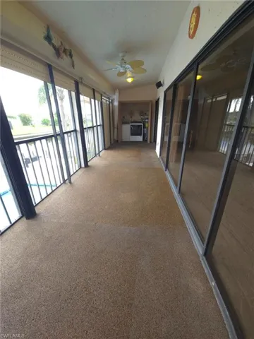 Unfurnished sunroom featuring carpet flooring