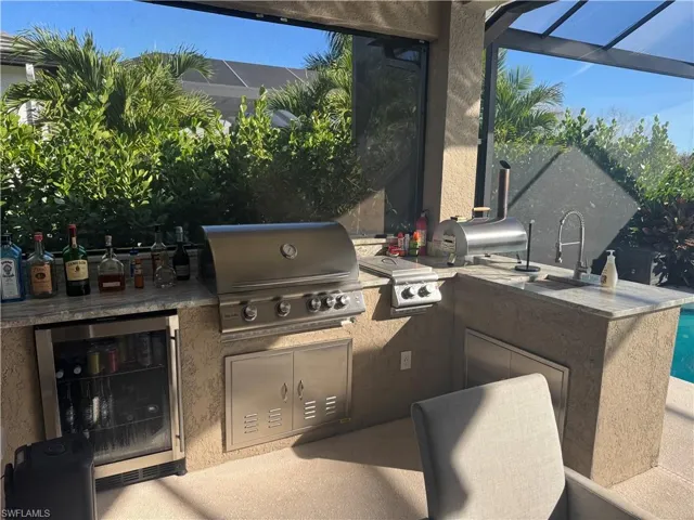 View of patio / terrace with exterior kitchen and wine cooler