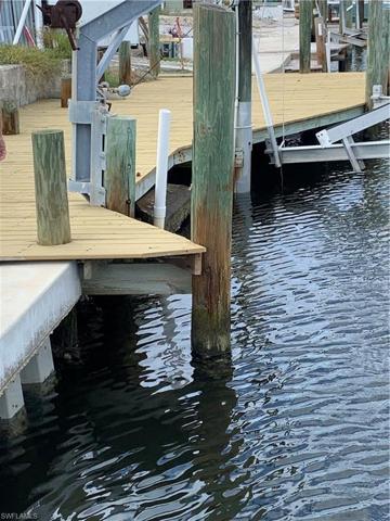 Existing dock and seawall, damaged by Hurricane Ian.