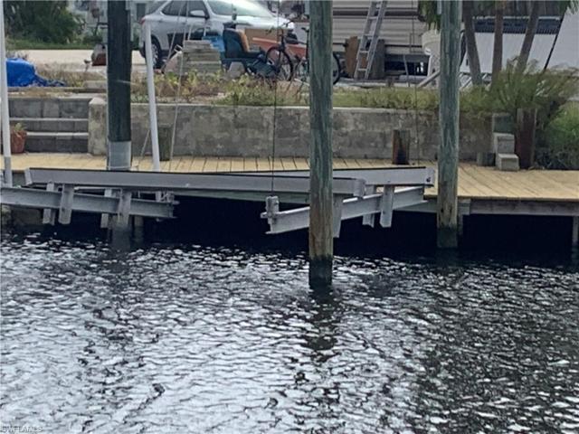 Existing boat lift, damaged by Hurrican Ian.