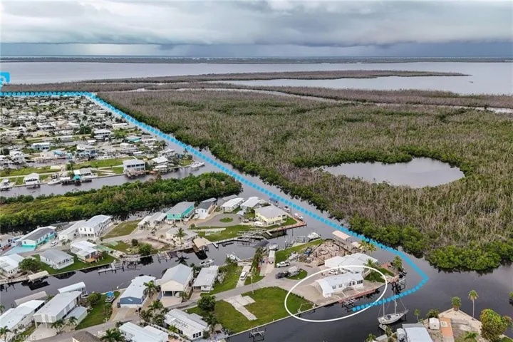 Aerial perspective of suburban area with a large body of water