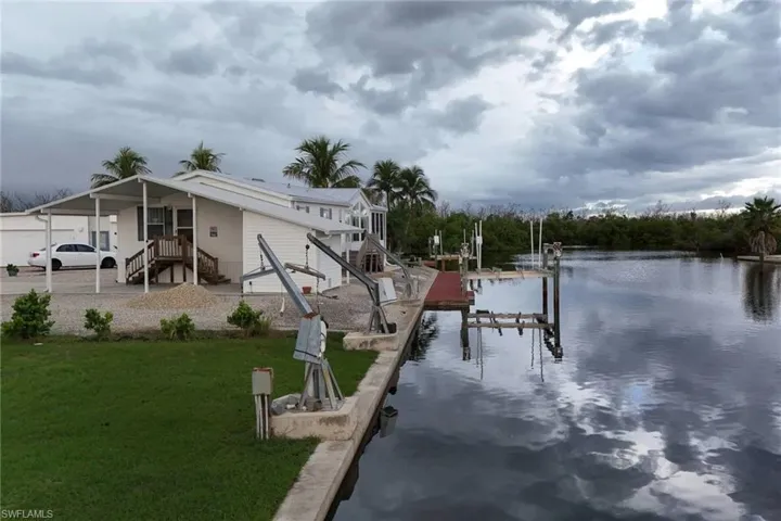 Dock with boat lift, and a water view