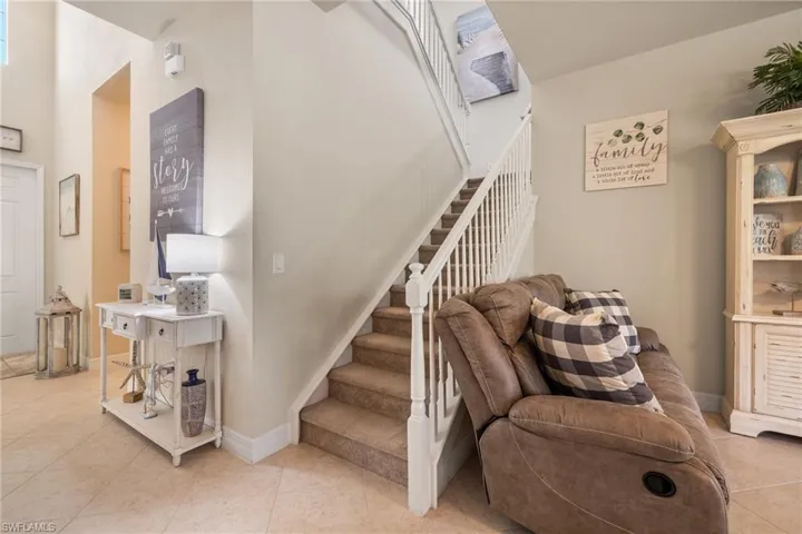 Staircase with tile patterned floors