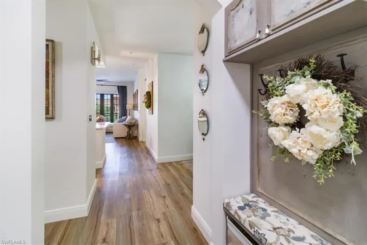 Hall with light hardwood / wood-style floors