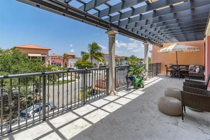 View of patio with a pergola, an outdoor living space, and a balcony