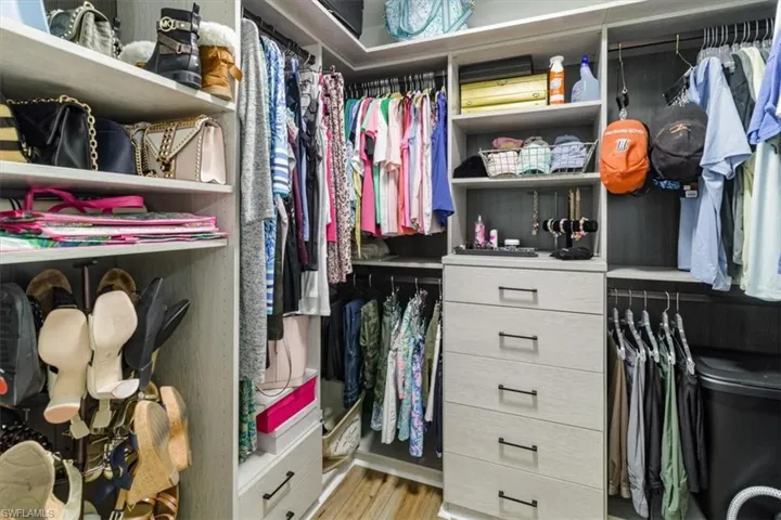 Walk in closet featuring light hardwood / wood-style floors