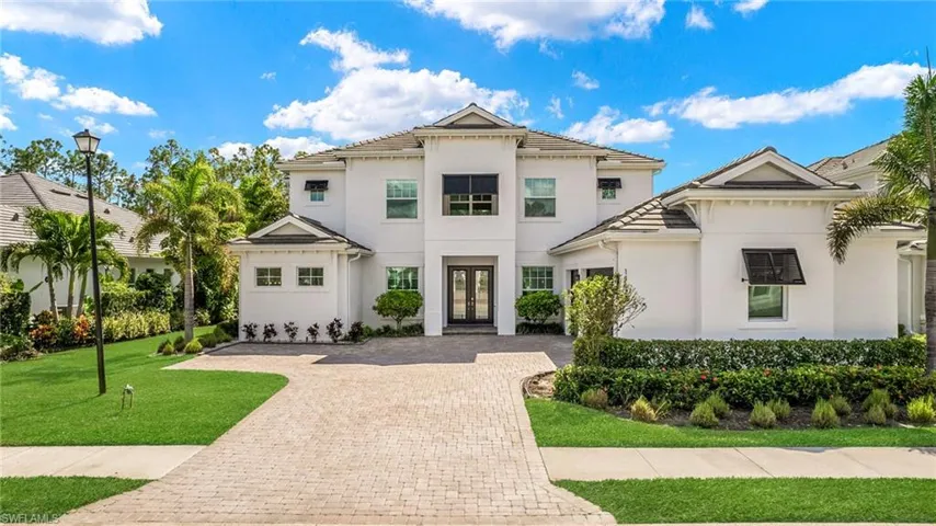 Mediterranean / spanish-style house with a front yard