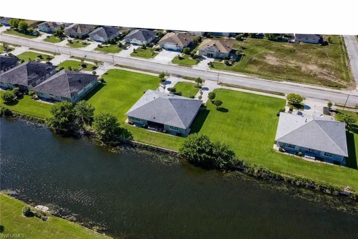 Aerial overview of property's location with nearby suburban area