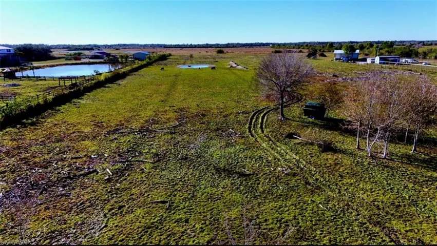 Birds eye view of property featuring a rural view and a water view