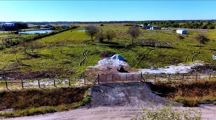Drone / aerial view with a water view and a rural view