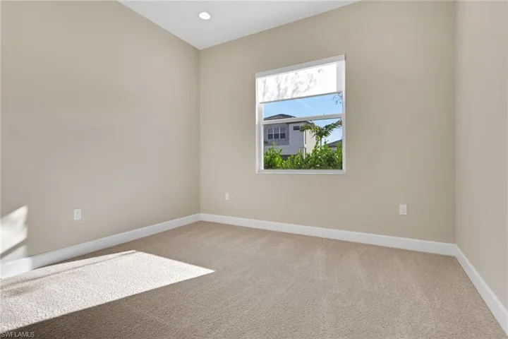 Unfurnished room with light carpet and recessed lighting