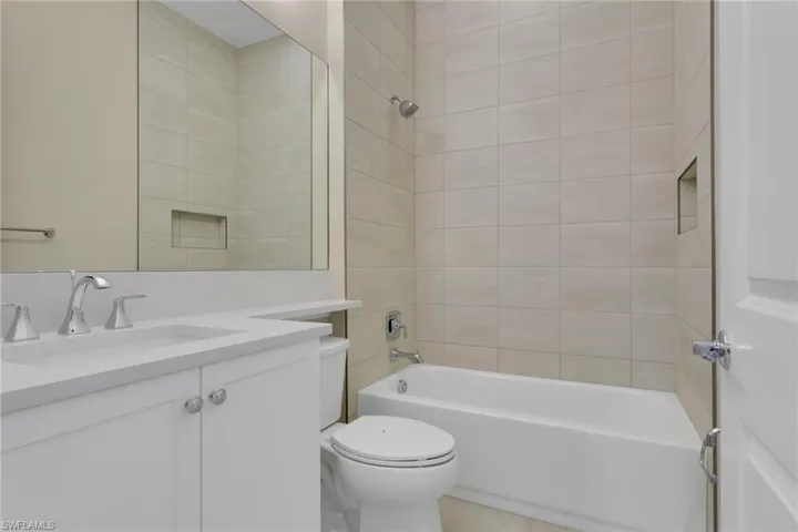 Bathroom with bathtub / shower combination and vanity