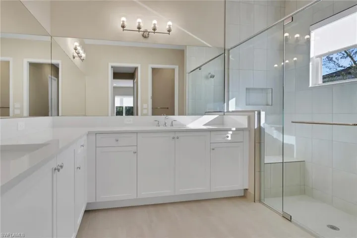 Bathroom with a walk in shower and double vanity