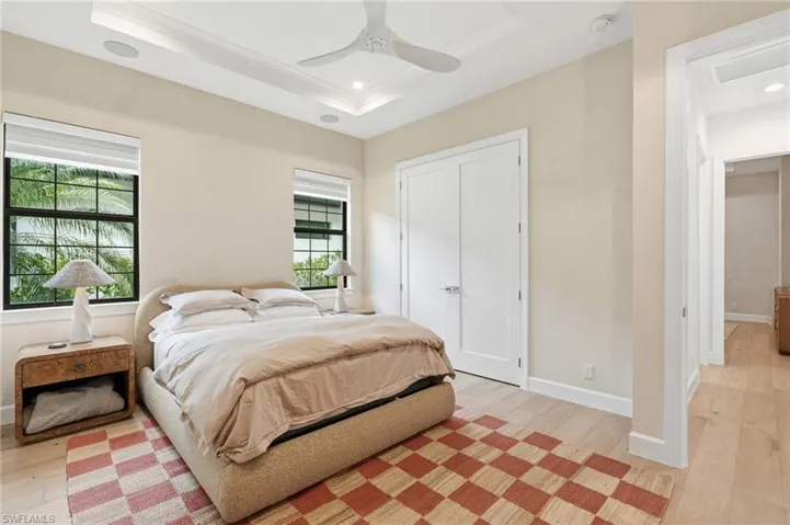 Light wood-finish flooring complements the neutral wall tones