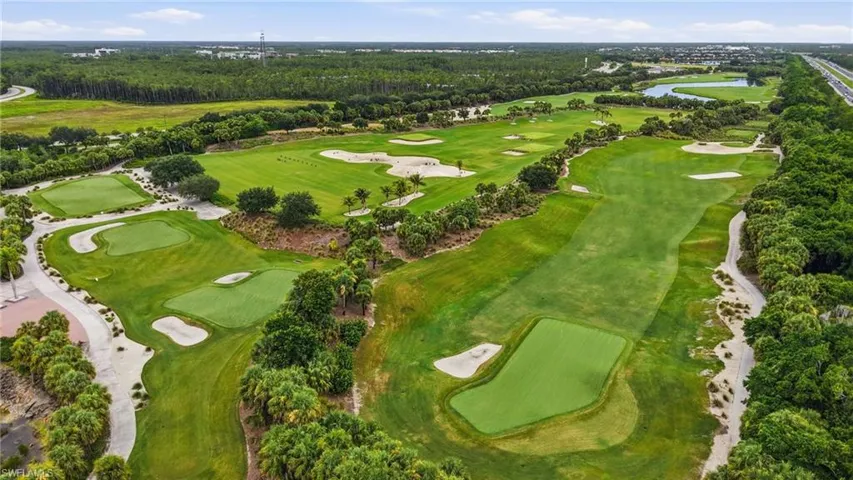 Expansive golf course featuring multiple greens, sand traps, and fairway sections