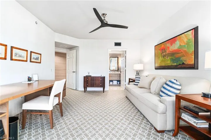 Living room featuring ceiling fan