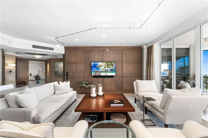Living room featuring ornamental molding
