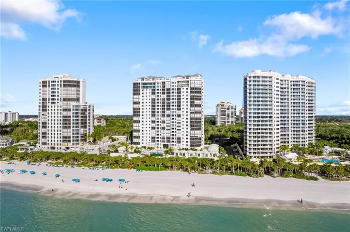 Drone / aerial view with a view of the beach and a water view