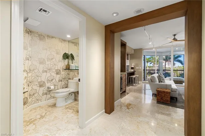Bathroom with ceiling fan and toilet