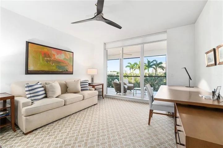 Living room featuring ceiling fan