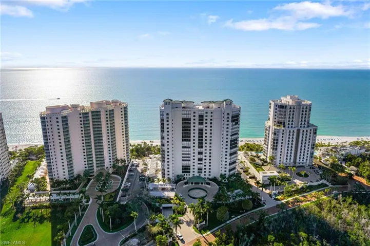 Aerial view with a water view and a beach view
