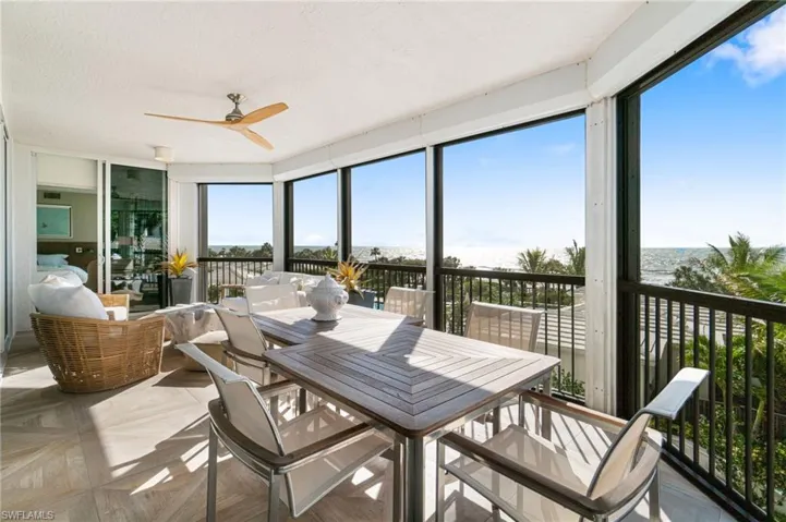 Expansive Lanai featuring a water view, ceiling fan, and a wealth of natural light
