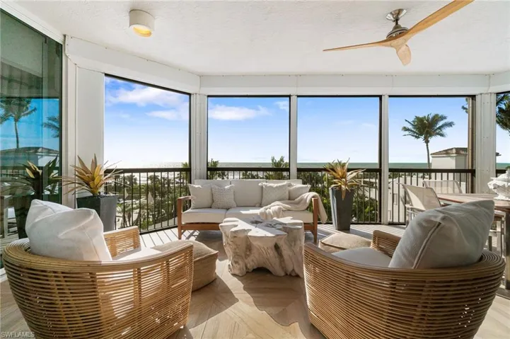 Expansive Lanai with a water view and ceiling fan