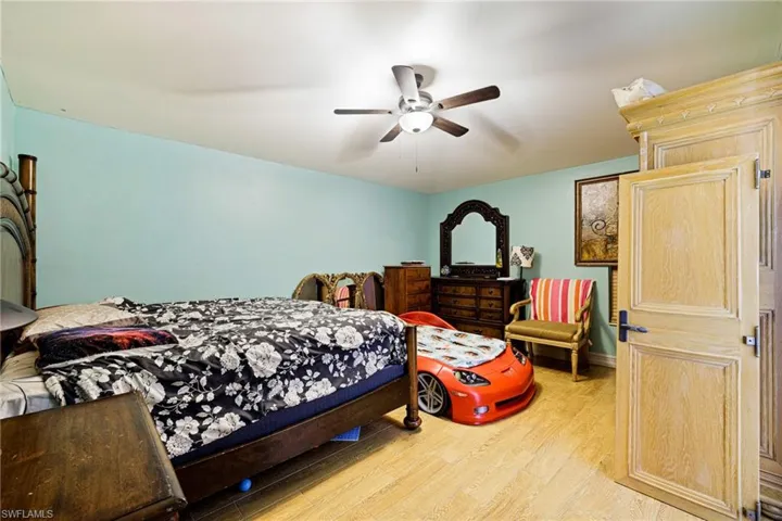 Bedroom featuring light wood-style flooring and ceiling fan