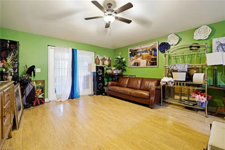 Living room featuring wood finished floors and ceiling fan