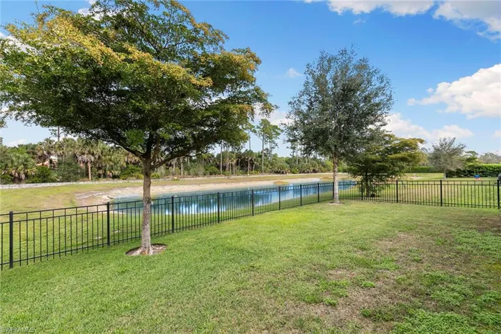 View of yard featuring a water view and view of scattered trees
