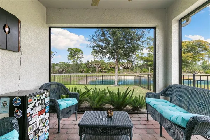 Sunroom / solarium with a ceiling fan, a patio area, outdoor lounge area, and plenty of natural light
