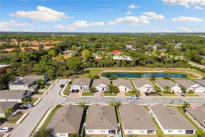 Aerial perspective of suburban area with a large body of water