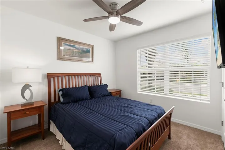Bedroom with carpet and ceiling fan