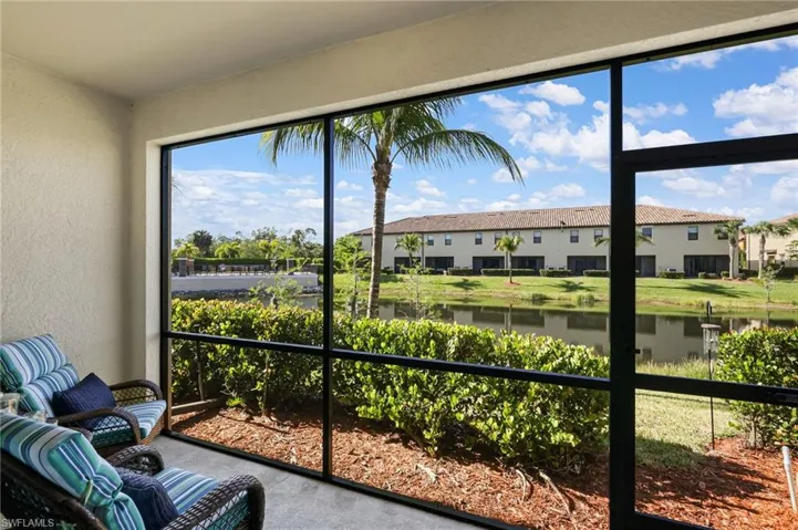 Rear lanai with southern exposure.  View is of lake and community pool