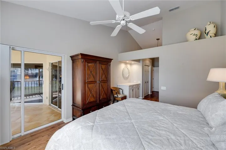 Primary bedroom with access to the screened balcony