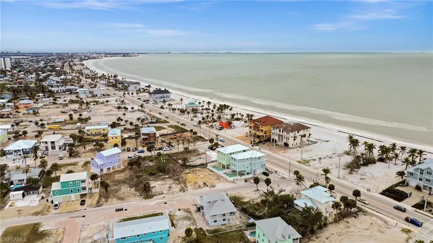 Bird's eye view with a water view and a beach view