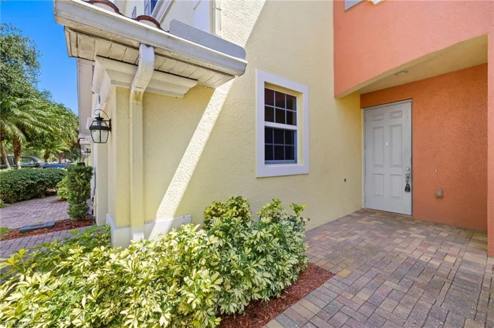 View of exterior entry featuring stucco siding
