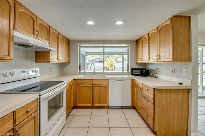 Glass top stove wood cabinetsbright and airy