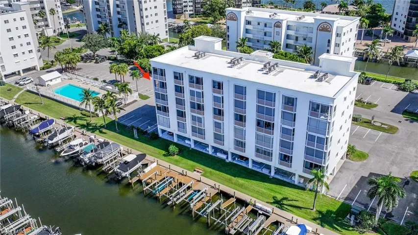Aerial view of apartment complex and a large body of water