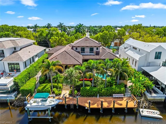 View from above of property with a tree filled landscape