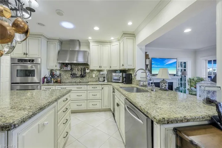SO MANY EXTRAS throughout this IMMACULATE, much-loved home . . . solar tube and can lights in the Kitchen. Lights are on dimmer switches.