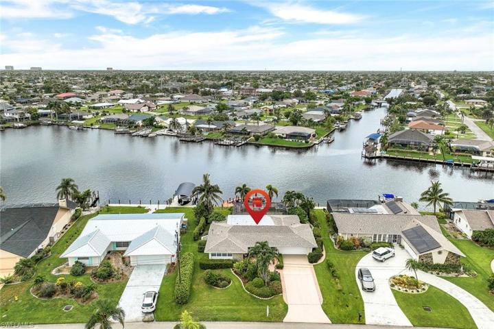 EXPANSIVE 3-way INTERSECTING Canal view! Ideally located in the heart of Cape Coral.
