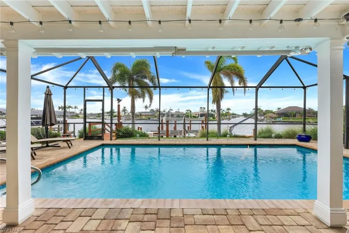 Sparkling blue salt water pool & paved deck overlooks 3 directions of water!