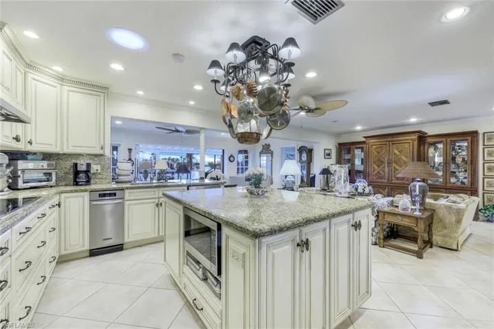 Granite counters; high-end appliances; upgraded fixtures & hardware; raised-panel wood cabinets.