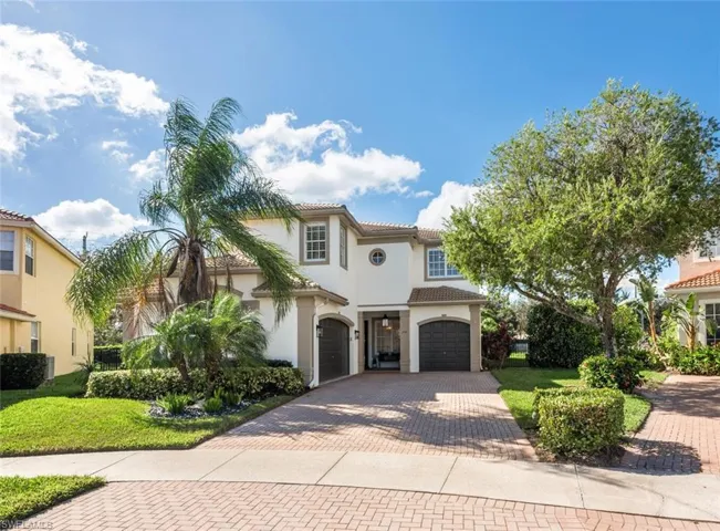 Mediterranean / spanish-style home featuring a front lawn and a 3 car garage